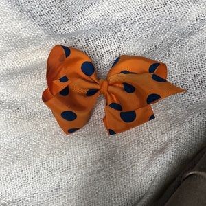Orange bow  with blue dots